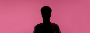 sillhouette of a person in front of a pink background (representing the customer persona
