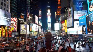 Photo of Times Square - featuring mcdonalds logo, tgi Fridays logo, kodak logo, bank of america logo, toshiba logo